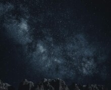 Starry sky with Milky Way over mountains