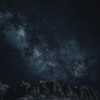 Starry sky with Milky Way over mountains