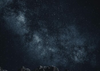 Starry sky with Milky Way over mountains